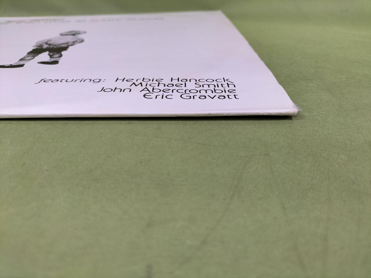 AIRBORNE Record: HE WHO LIVES IN MANY PLACES