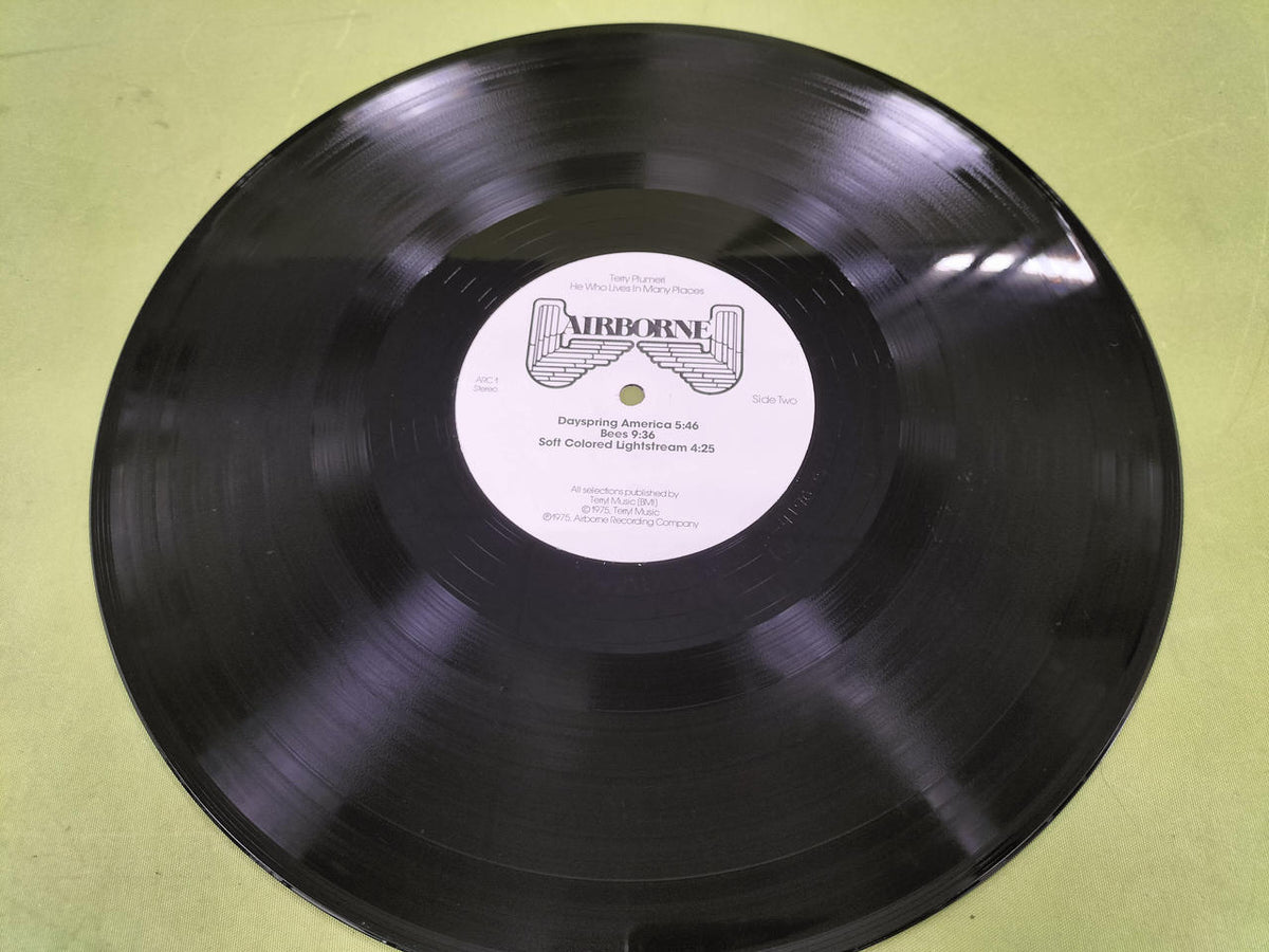 AIRBORNE Record: HE WHO LIVES IN MANY PLACES