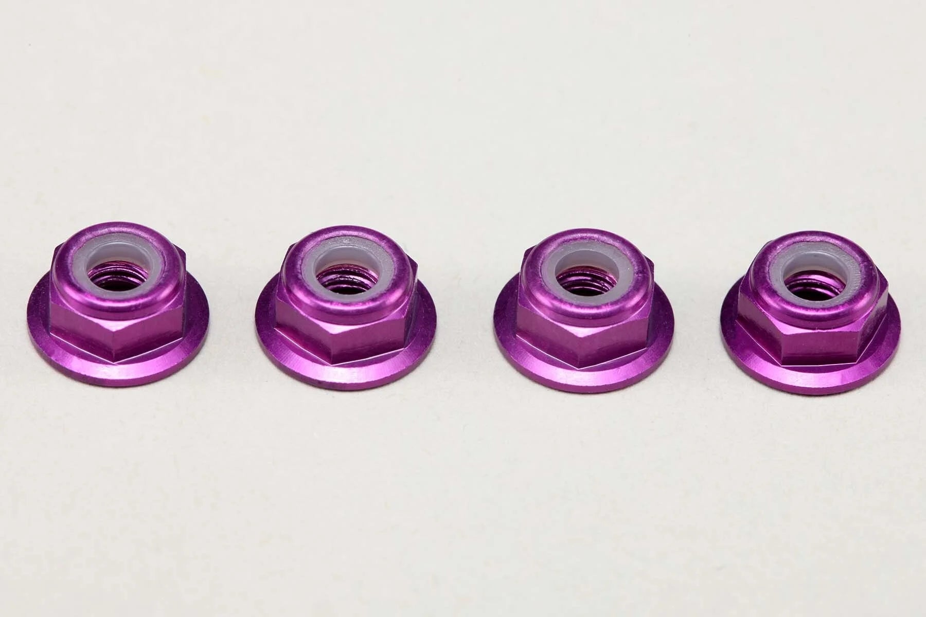 (PO MAY 2026) Yokomo ZC-N4AFLPU Aluminum 4mm Thin Flanged Nylon Lock Nuts / Purple (4pcs) - BanzaiHobby