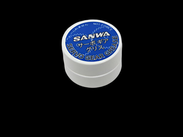Small container of Sanwa servo gear grease on a white background